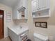 This cozy bathroom features white cabinets, a mirrored medicine cabinet, and a sink with a vanity at 151 Robinson Rd, Gastonia, NC 28056