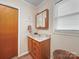 Compact bathroom design with vanity, sink, mirror cabinet and towel rack at 151 Robinson Rd, Gastonia, NC 28056