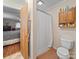 This is a bathroom with a shower and vanity with wooden cabinet for ample storage and a toilet at 151 Robinson Rd, Gastonia, NC 28056