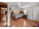 Comfortable bedroom with a view of a bathroom, closet, a wooden bed, and lamps at 151 Robinson Rd, Gastonia, NC 28056