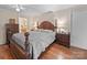 Bedroom with wooden furniture set, including a dresser and lamps for a relaxing ambiance at 151 Robinson Rd, Gastonia, NC 28056