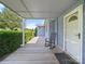 Inviting front porch with a rocking chair and a view of the lush green lawn at 151 Robinson Rd, Gastonia, NC 28056