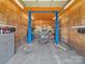 Garage interior equipped with an auto lift at 151 Robinson Rd, Gastonia, NC 28056