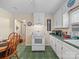 Practical kitchen design with classic stove, white cabinets, and dining area for everyday meals at 151 Robinson Rd, Gastonia, NC 28056