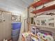 This storage area includes an ironing board, shelving units, and a variety of household supplies at 151 Robinson Rd, Gastonia, NC 28056