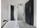 Spa-like bathroom features a glass enclosed shower, storage cabinet, and freestanding tub for relaxation at 1511 Waverly Ave, Charlotte, NC 28203