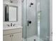Modern bathroom featuring a glass shower door, tile surround, and sleek black hardware at 1511 Waverly Ave, Charlotte, NC 28203