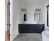 Stylish bathroom showcases double vanity, modern mirrors, elegant lighting and access to tub and shower at 1511 Waverly Ave, Charlotte, NC 28203