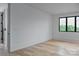 Airy room with large window offers ample natural light and lovely outdoor views at 1511 Waverly Ave, Charlotte, NC 28203