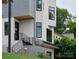 Modern home features sleek lines, an iron stair railing, and excellent curb appeal at 1511 Waverly Ave, Charlotte, NC 28203