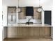 Kitchen featuring a large island with white countertops and stainless-steel appliances at 1511 Waverly Ave, Charlotte, NC 28203