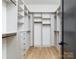 Custom walk-in closet with adjustable shelving, drawers and hanging racks offer maximum storage and organization at 1511 Waverly Ave, Charlotte, NC 28203