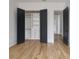 Custom walk-in closet boasts thoughtful design with shelving, drawers, and ample storage behind double doors at 1511 Waverly Ave, Charlotte, NC 28203