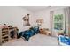 Playful bedroom featuring a space-themed bedspread and toy decor at 15620 Glen Miro Dr, Huntersville, NC 28078