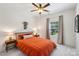 Well-lit bedroom features a simple yet stylish bed and warm decor at 15620 Glen Miro Dr, Huntersville, NC 28078