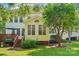 Charming home exterior with a sunroom, wooden deck, and a lush, green lawn on a sunny day at 15620 Glen Miro Dr, Huntersville, NC 28078