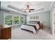 Spacious main bedroom features tray ceilings and large windows at 15620 Glen Miro Dr, Huntersville, NC 28078