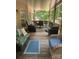 Spacious back porch with comfortable seating and views of the wooded backyard at 1713 Arbor Way, Albemarle, NC 28001
