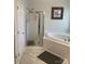 Bright bathroom featuring a garden tub and glass shower at 1713 Arbor Way, Albemarle, NC 28001