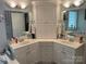 Bright bathroom with dual sinks and a cabinet at 1713 Arbor Way, Albemarle, NC 28001
