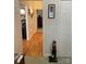 Inviting hallway with hardwood floors, framed artwork, and access to various rooms at 1713 Arbor Way, Albemarle, NC 28001