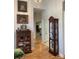 Bright hallway showcasing hardwood floors and beautiful decor, with doorways leading to other rooms at 1713 Arbor Way, Albemarle, NC 28001