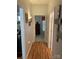 Bright hallway with hardwood floors leads to a bedroom at 1713 Arbor Way, Albemarle, NC 28001