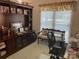 Comfortable home office with built-in bookshelves, bench seating, and ample natural light at 1713 Arbor Way, Albemarle, NC 28001