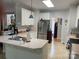 Well-equipped kitchen with stainless steel appliances, white cabinets, and a convenient island at 1713 Arbor Way, Albemarle, NC 28001