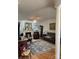 Cozy living room with a fireplace, hardwood floors, and comfortable seating arrangements at 1713 Arbor Way, Albemarle, NC 28001