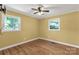 Bedroom with two windows, hardwood flooring, and a ceiling fan at 203 Nottingham Dr, York, SC 29745