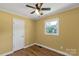 Bedroom with hardwood flooring, ceiling fan, and ample natural light at 203 Nottingham Dr, York, SC 29745