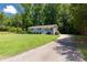 Exterior view of the house showing a driveway and a well manicured front lawn at 203 Nottingham Dr, York, SC 29745