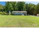 Charming one-story home with light blue brick, black shutters, and a large lawn at 203 Nottingham Dr, York, SC 29745