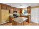 Well-lit kitchen with wood cabinets, granite countertops, and stainless steel appliances at 203 Nottingham Dr, York, SC 29745