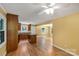 Open kitchen features wood cabinets, island, granite countertops, and stainless steel appliances at 203 Nottingham Dr, York, SC 29745