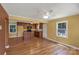 Open kitchen and dining area with hardwood floors and a center island at 203 Nottingham Dr, York, SC 29745