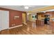 Open concept layout of the living room and kitchen area with hardwood floors at 203 Nottingham Dr, York, SC 29745