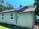 Image of the exterior of a home, showing siding, a chimney, and updated windows at 213 Maple St, Rock Hill, SC 29730