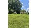 Backyard featuring grass with a building in the background at 2216 Helen Dr, Gastonia, NC 28054