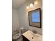 Half bathroom with vanity, mirror, and toilet at 2216 Helen Dr, Gastonia, NC 28054