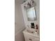 Bathroom with sink, white cabinets, and mirror at 2216 Helen Dr, Gastonia, NC 28054