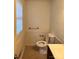 Small half bathroom with toilet and a sink at 2216 Helen Dr, Gastonia, NC 28054