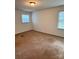 Neutral bedroom with carpet, bright light fixture, and one window at 2216 Helen Dr, Gastonia, NC 28054