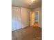 Bedroom featuring a closet, neutral paint, and carpet at 2216 Helen Dr, Gastonia, NC 28054
