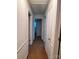 Hallway with carpet and multiple access doors to other rooms at 2216 Helen Dr, Gastonia, NC 28054