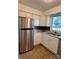 Kitchen featuring stainless steel refrigerator and sink with white cabinets at 2216 Helen Dr, Gastonia, NC 28054