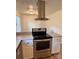 Kitchen featuring stainless steel oven and white cabinets at 2216 Helen Dr, Gastonia, NC 28054
