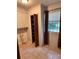 Bright laundry room with tiled floor, built in storage cabinet, and window with natural light at 2216 Helen Dr, Gastonia, NC 28054
