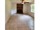 Living room with brick fireplace, tiled floors, and natural light at 2216 Helen Dr, Gastonia, NC 28054